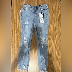 Women’s high rise distressed skinny jeans